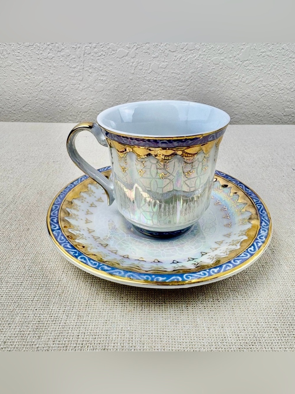 Iridescent Porcelain Teacup & Saucer with Gold and Blue Trim